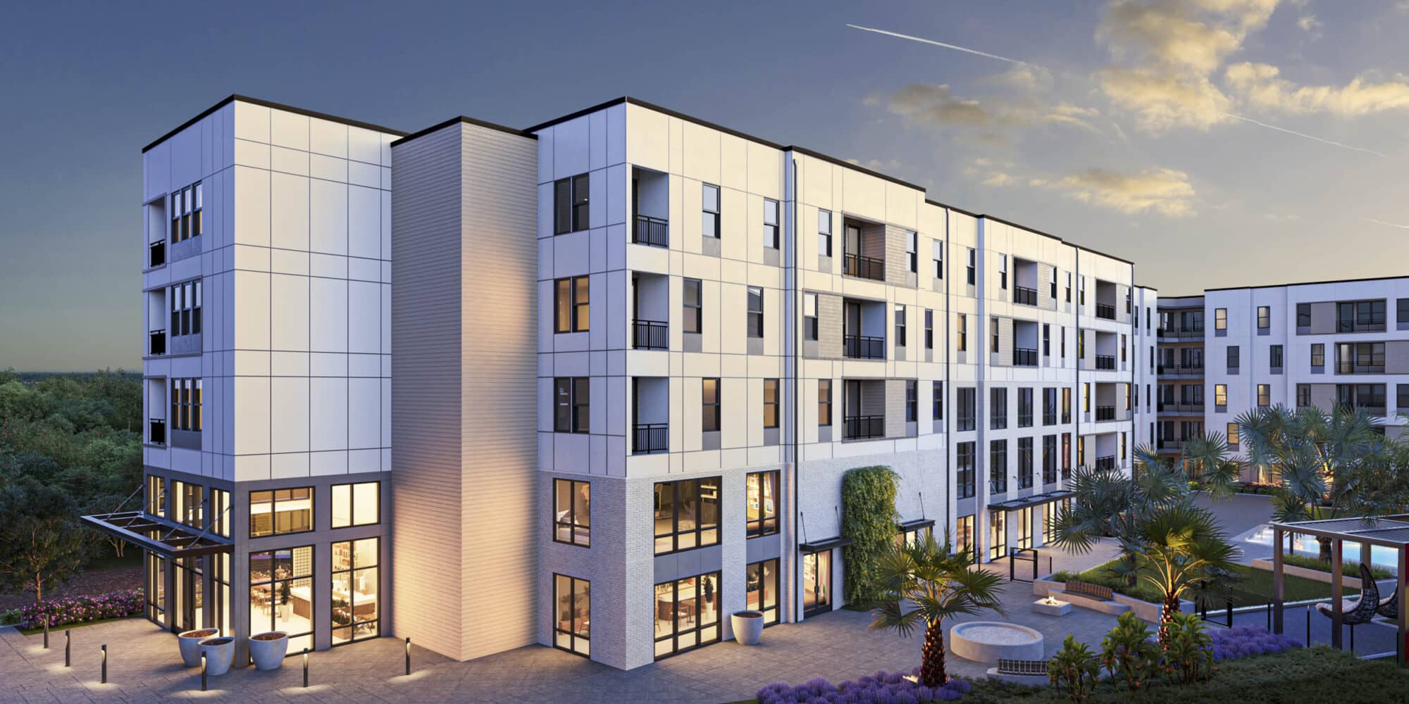 exterior of white and gray midrise apartment building surrounded by palm trees